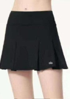 Alo Black skirt worn by a person on a white background