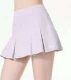 Alo Light purple pleated skirt worn by a person on a white background