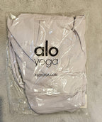 Gray tote bag with 'alo yoga' logo on a light gray background