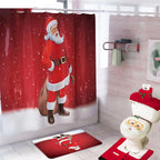 Bathroom set with Santa Claus shower curtain, rug, and toilet cover.