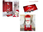 Set of Christmas-themed bathroom accessories including a shower curtain, rug, and toilet cover with Santa Claus design.