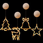 Decorative Christmas lights shaped like a tree, reindeer, bell, and star 