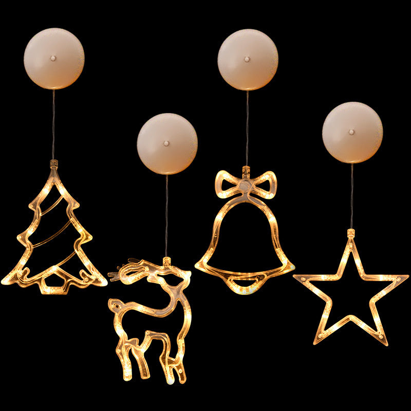 Decorative Christmas lights shaped like a tree, reindeer, bell, and star 