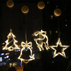 Decorative LED lights shaped like a tree, bell, reindeer, and star