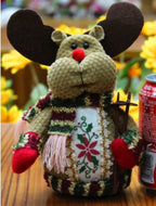 Decorative moose figure with a patterned scarf 