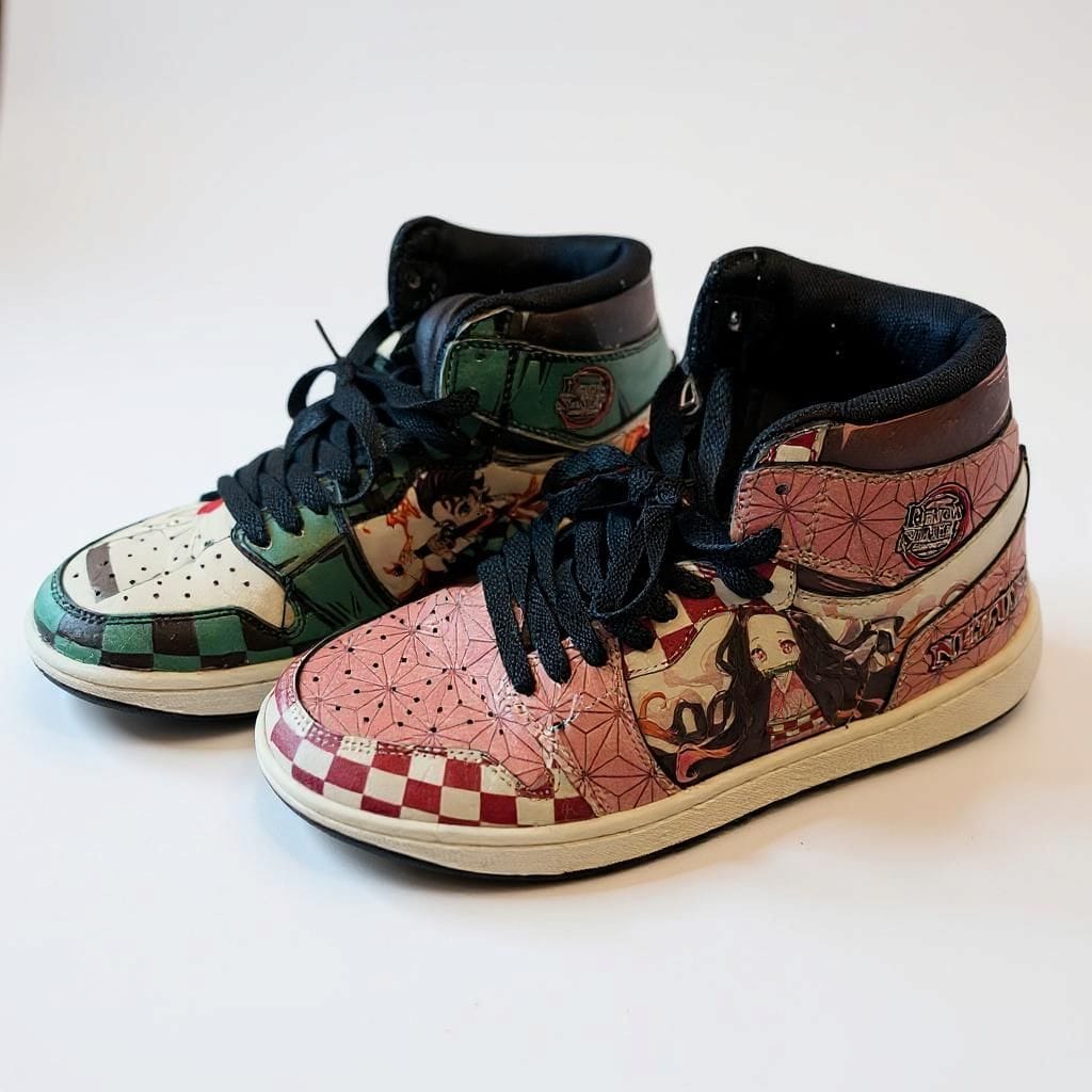 Pair of colorful high-top Demon Slayer sneakers with patterned design