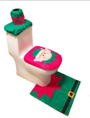 Christmas-themed toilet set with cover, seat cover, and rug