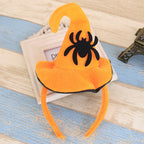 Orange headband with a black spider design 