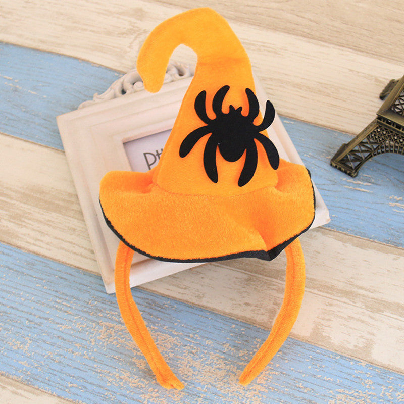 Orange headband with a black spider design 