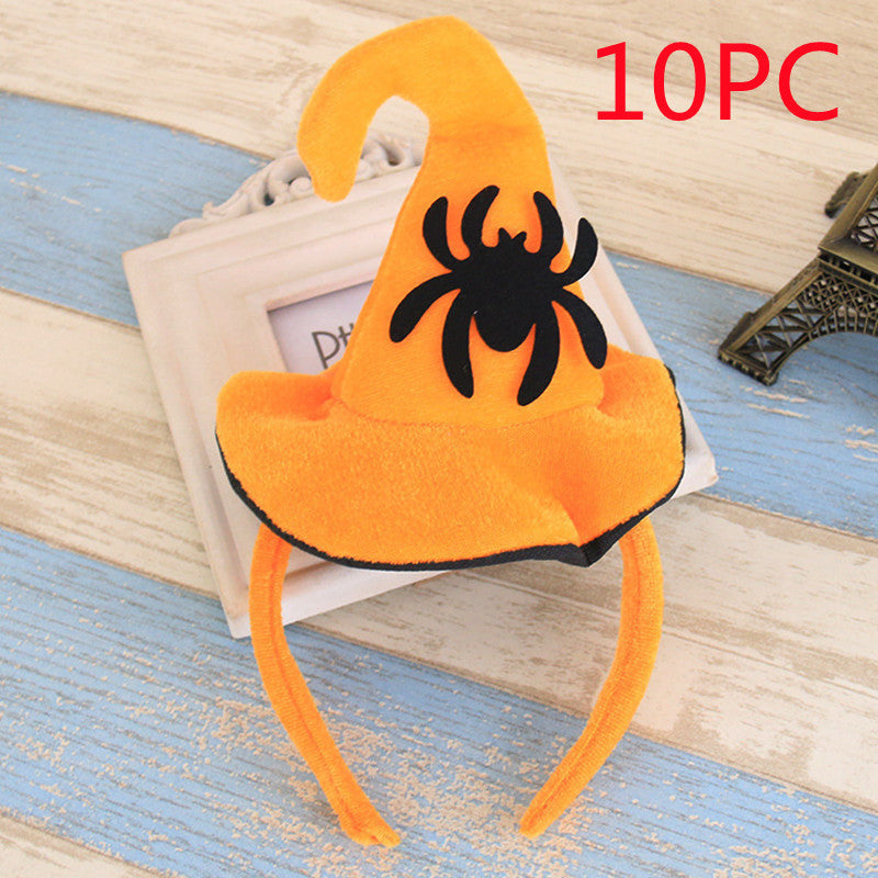Orange headband with black spider design on a wooden surface, labeled '10PC'.