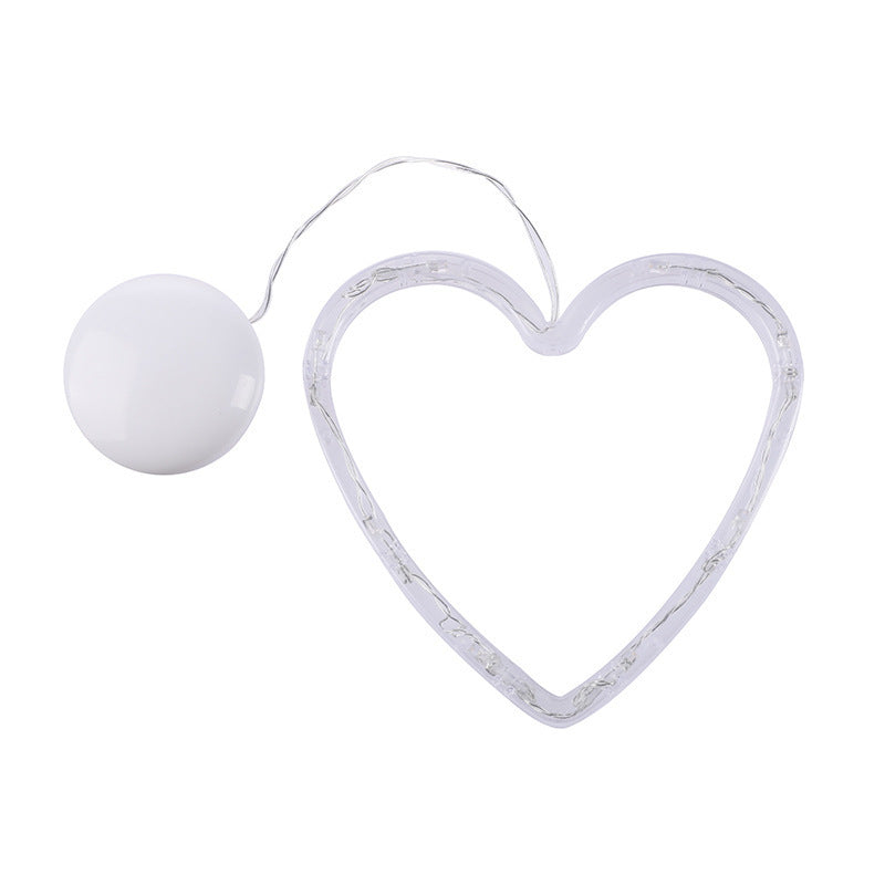 Heart-shaped light fixture with a white bulb 