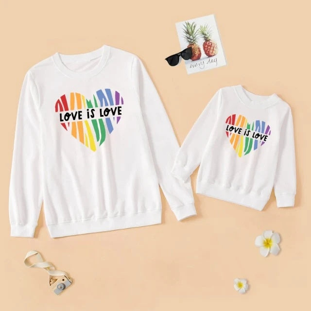 Two white sweatshirts with rainbow heart design and 'Love is Love' text