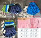 Collage of Lululemon shorts in various colors with size chart and details on a textured surface.