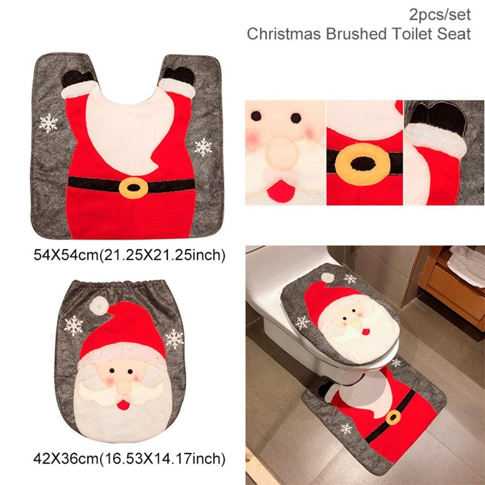 Christmas-themed toilet seat cover set with Santa Claus design, including dimensions and a bathroom setting.