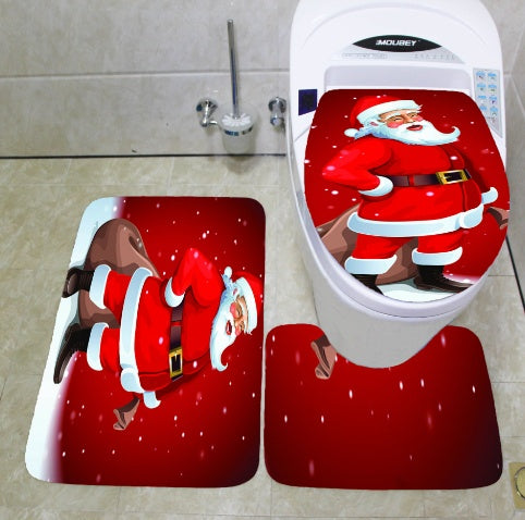 Santa Claus-themed toilet seat cover and rug set on a bathroom floor.
