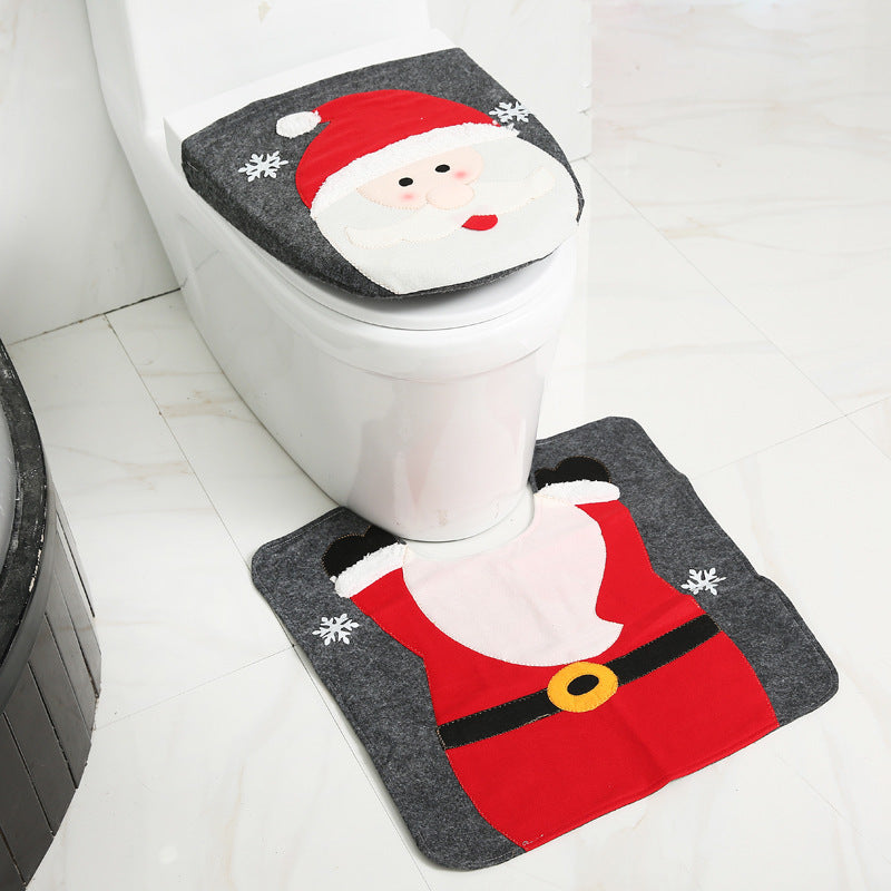 Santa Claus-themed toilet seat cover and rug set  