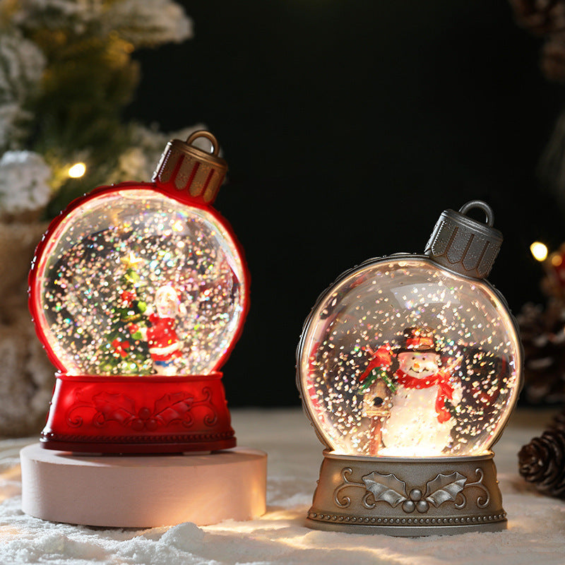 Two Christmas-themed snow globes with Santa and a snowman inside, set against a festive background.